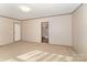 Bright living room with carpet and door to bathroom at 408 Silk And Tassel Row, Cleveland, NC 27013