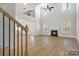 Spacious great room with hardwood floors, fireplace, and high ceilings at 9411 Stonebridge Way # 49, Mint Hill, NC 28227