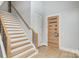 Modern staircase with wooden steps and metal railing at 2305 Sanders Ave, Charlotte, NC 28216