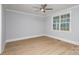 Spacious bedroom with hardwood floors and ceiling fan at 2305 Sanders Ave, Charlotte, NC 28216