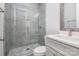 Bathroom with a walk-in shower, grey tile, and modern vanity at 2305 Sanders Ave, Charlotte, NC 28216
