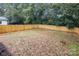 Large backyard with wooden privacy fence at 2305 Sanders Ave, Charlotte, NC 28216