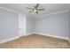 Bright bedroom with hardwood floors and ceiling fan at 2305 Sanders Ave, Charlotte, NC 28216