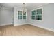 Bright dining room with hardwood floors and large windows at 2305 Sanders Ave, Charlotte, NC 28216