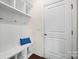 Bright mudroom with built-in bench, cubbies, and hooks for storage at 764 Garrett Green Way, Fort Mill, SC 29715