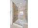 Large walk-in shower with glass enclosure and built-in seat at 764 Garrett Green Way, Fort Mill, SC 29715