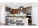 Modern kitchen with dark brown cabinets, granite countertops, and stainless steel appliances at 5276 Scotts Creek Rd, Indian Land, SC 29707