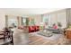 Open living and dining area with hardwood floors and stylish furnishings at 5276 Scotts Creek Rd, Indian Land, SC 29707