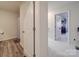 Bathroom with shower and wood-look flooring at 13111 Cottage Crest Ln, Charlotte, NC 28273