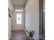Light and airy entryway with wood-look floors and glass-paned door at 13111 Cottage Crest Ln, Charlotte, NC 28273
