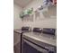 Laundry room with washer, dryer, and shelving at 13111 Cottage Crest Ln, Charlotte, NC 28273