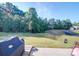 Backyard patio with grill and view of treeline at 13111 Cottage Crest Ln, Charlotte, NC 28273