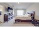 Spacious bedroom with large bed, dresser, and plenty of natural light at 13111 Cottage Crest Ln, Charlotte, NC 28273