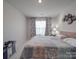Bedroom with a queen-size bed and window coverings at 13111 Cottage Crest Ln, Charlotte, NC 28273