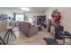 Finished basement with sectional sofa, large TV, and home gym at 13111 Cottage Crest Ln, Charlotte, NC 28273