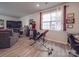 Finished basement with sectional sofa, large TV, and home gym at 13111 Cottage Crest Ln, Charlotte, NC 28273