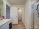 Bathroom with a shower, toilet and a single vanity at 13111 Cottage Crest Ln, Charlotte, NC 28273