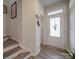 Light and airy entryway with wood-look floors and glass-paned door at 13111 Cottage Crest Ln, Charlotte, NC 28273