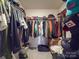 Walk-in closet with double hanging rods and shelving for ample storage at 13111 Cottage Crest Ln, Charlotte, NC 28273