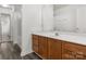 Bathroom with wood cabinets and a large mirror at 1584 Arborgate Dr # 90, Rock Hill, SC 29732