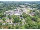 Aerial view showing home's location near shops and green spaces at 1517 Kimberly Rd, Charlotte, NC 28208