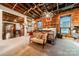 Primary bedroom with exposed brick walls, high ceiling, and comfortable seating at 310 Arlington Ave # Multiple, Charlotte, NC 28203