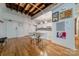 Bright dining area with hardwood floors and exposed beams, adjacent to the kitchen at 310 Arlington Ave # Multiple, Charlotte, NC 28203
