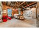 Large bedroom with exposed brick walls and unique decor at 310 Arlington Ave # Multiple, Charlotte, NC 28203