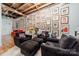 Spacious living room featuring exposed wooden beams and a gallery wall at 310 Arlington Ave # Multiple, Charlotte, NC 28203