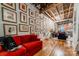 Living area with red sofa and hardwood floors, exposed wooden beams at 310 Arlington Ave # Multiple, Charlotte, NC 28203