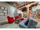 Relaxing living area with red armchairs, gray sofa, and eclectic decor at 310 Arlington Ave # Multiple, Charlotte, NC 28203