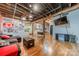 Large living area with hardwood floors, exposed beams, and eclectic decor at 310 Arlington Ave # Multiple, Charlotte, NC 28203