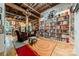 Comfortable sitting area with vintage armchairs and a large bookshelf at 310 Arlington Ave # Multiple, Charlotte, NC 28203