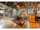 Spacious loft features exposed brick, hardwood floors, and built-in bookshelves at 310 Arlington Ave # Multiple, Charlotte, NC 28203