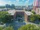 Aerial view of a commercial building with parking and city views at 310 Arlington Ave # Multiple, Charlotte, NC 28203