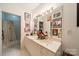 Elegant bathroom with double vanity and vintage artwork at 310 Arlington Ave # Multiple, Charlotte, NC 28203
