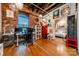 Bright home office with built-in shelving and a view of a bedroom at 310 Arlington Ave # Multiple, Charlotte, NC 28203