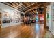 Spacious living area with exposed brick, hardwood floors, and high ceilings at 310 Arlington Ave # Multiple, Charlotte, NC 28203