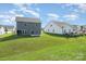 Two-story house exterior, gray siding, and backyard view at 2022 Mcdonald Dr, Oakboro, NC 28163