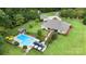 Aerial view showing home, pool, and surrounding landscape at 127 Spring Oaks Dr, Troutman, NC 28166