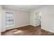 Bright bedroom with wood floors and access to a full bathroom at 305 N Watterson St, Kings Mountain, NC 28086