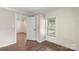 Simple bedroom with wood floors and an additional room at 305 N Watterson St, Kings Mountain, NC 28086