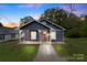 Charming renovated home with gray siding, red door and a covered porch at 305 N Watterson St, Kings Mountain, NC 28086