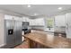 Modern kitchen with stainless steel appliances and a butcher block island at 305 N Watterson St, Kings Mountain, NC 28086