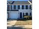 Brick front of two-story townhome with black shutters at 4016 Holly Villa Cir, Indian Trail, NC 28079