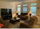 Living room with brown reclining sofas and a large TV at 4016 Holly Villa Cir, Indian Trail, NC 28079