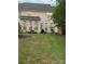 Landscaped backyard with a patio and grass at 4016 Holly Villa Cir, Indian Trail, NC 28079