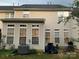 Back exterior view with patio and large sunroom at 4016 Holly Villa Cir, Indian Trail, NC 28079