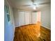 Bright bedroom with hardwood floors and ample closet space at 104 1/2 Tomberlin Rd, Mount Holly, NC 28120