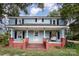 Blue house with a red brick porch and steps at 12137 Renee Ford Rd, Stanfield, NC 28163